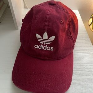 Dark red adidas baseball hat with white embroidered logo